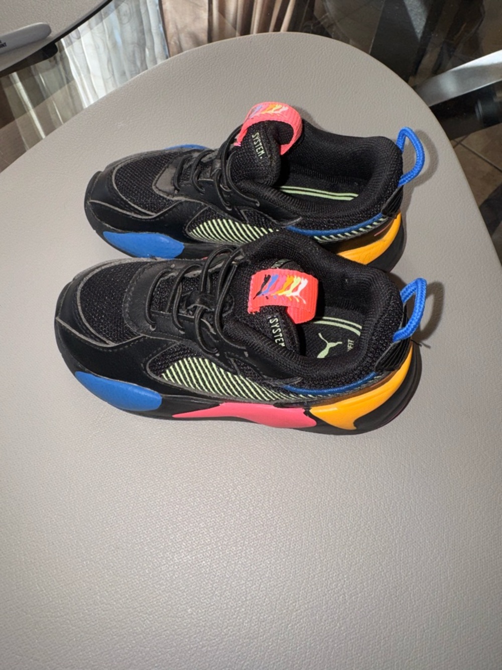 Puma Kids Black Sneakers with Blue, Pink and Yellow Accents